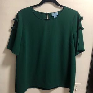 Green short sleeve top with shoulder bow details